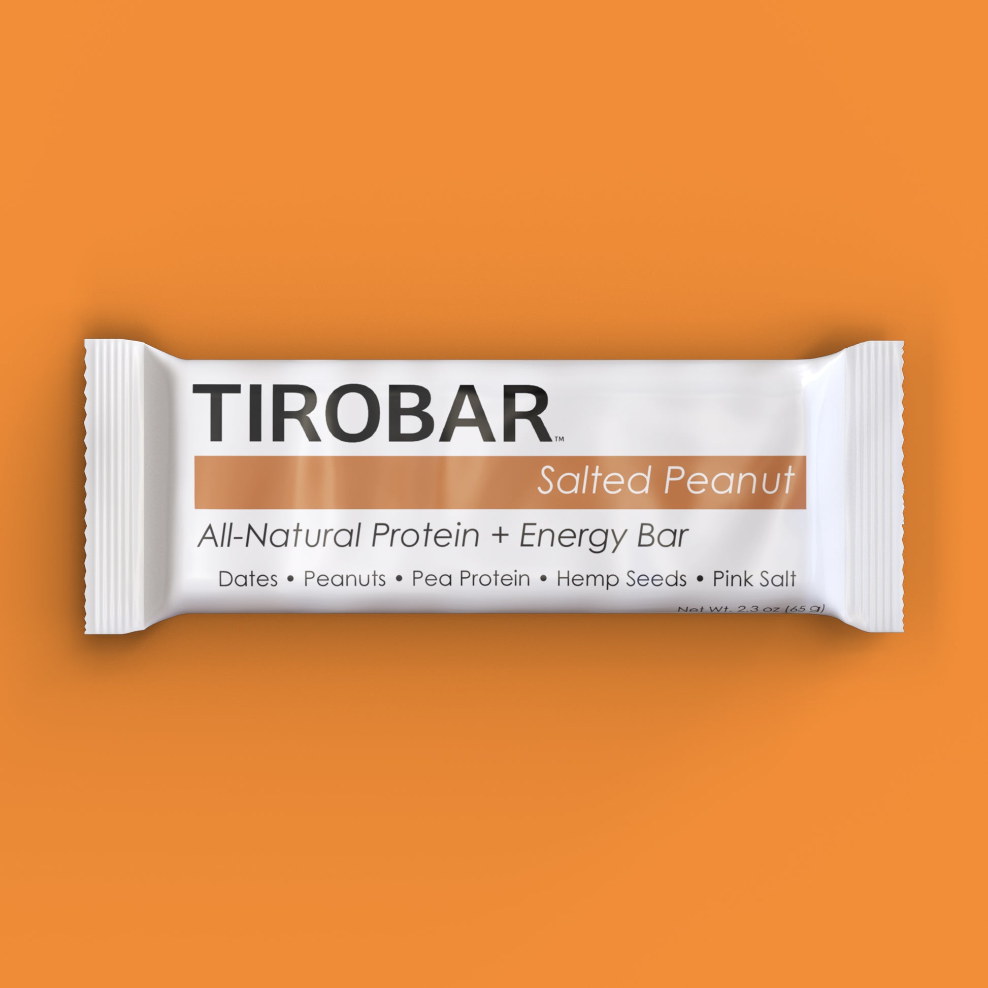 A salted peanut TIROBAR, a vegan and all natural protein bar, sits in a white wrapper against an orange background. The bar is visible from the top.